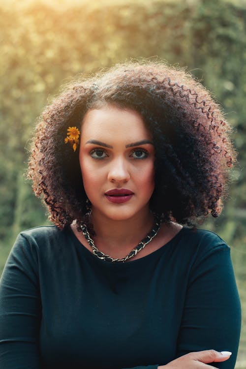 A Woman in Black Shirt with Afro Hair