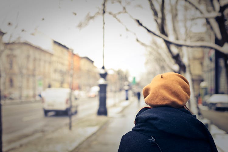 Person With Brown Hat Walking On Street