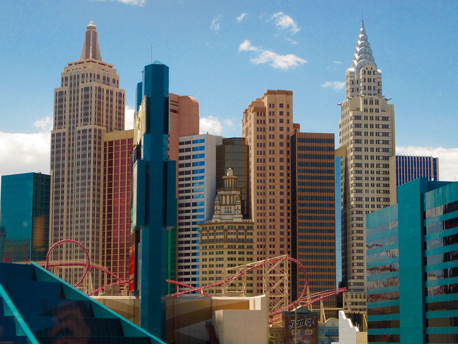 Atlantic City casino skyline at dusk, illuminated hotel towers beside the boardwalk and calm ocean