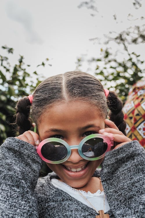 Girl in Colorful Framed Sunglasses