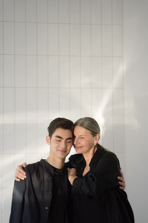 Free A touching moment of love and affection shared between a mother and son in an indoor setting. Stock Photo