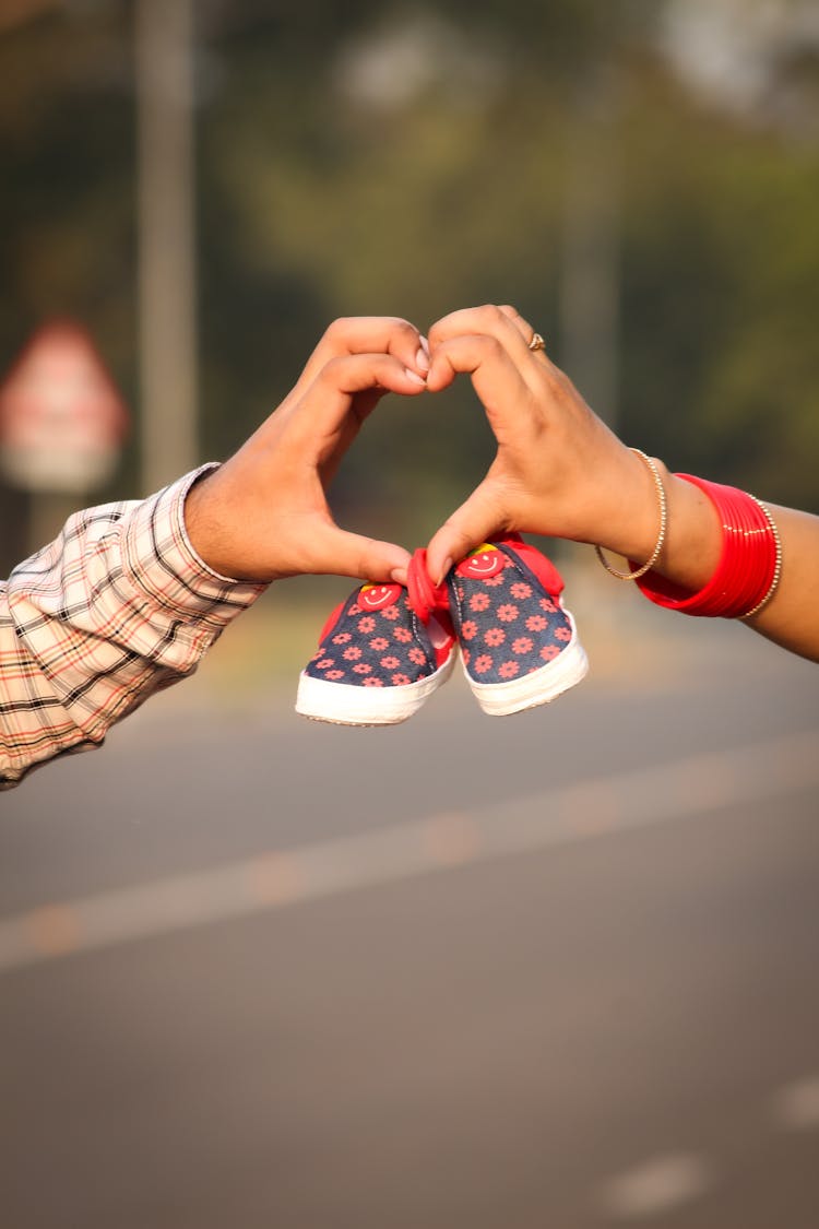 Photo Of People's Hands Forming A Heart Shape