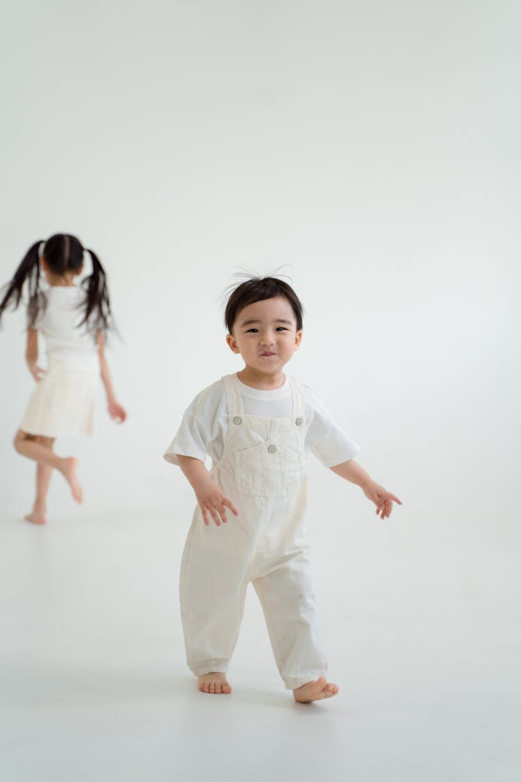 Little Boy In Jumper Walking 