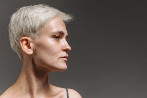 Free Side view profile portrait of a caucasian woman with short white hair. Stock Photo