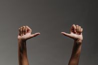 A Person Making a Hand Gesture
