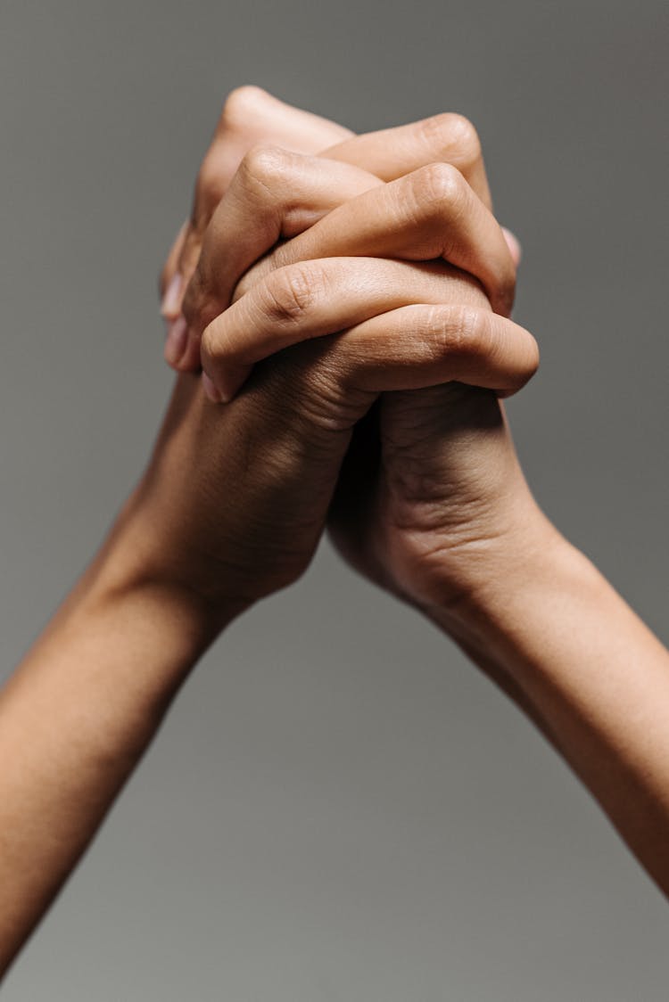 Close Up Photo Of Clasped Hands