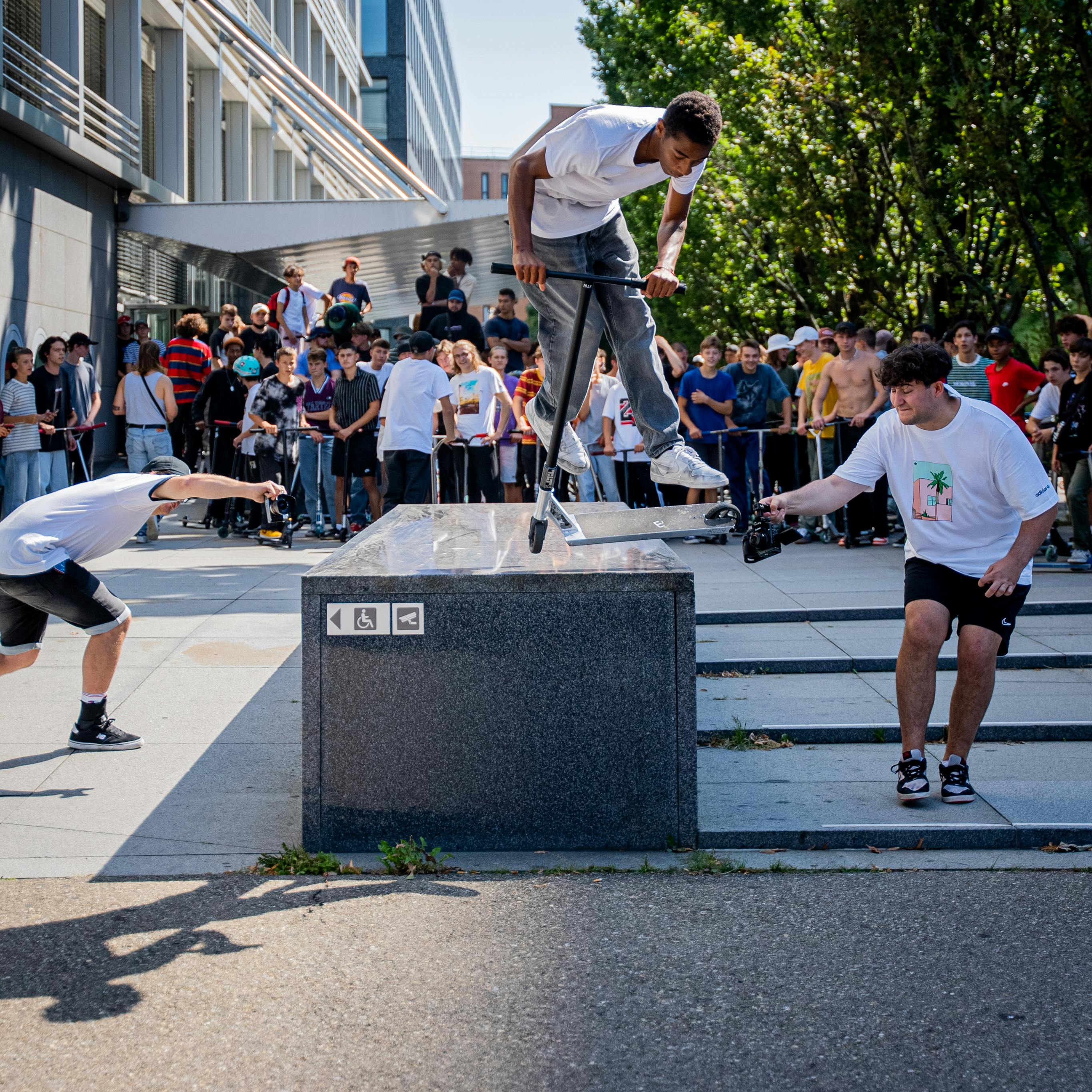 Street scooter performance in Zurich with a large crowd. Captured in action in broad daylight.