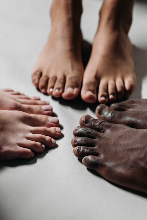 People's Feet on White Floor