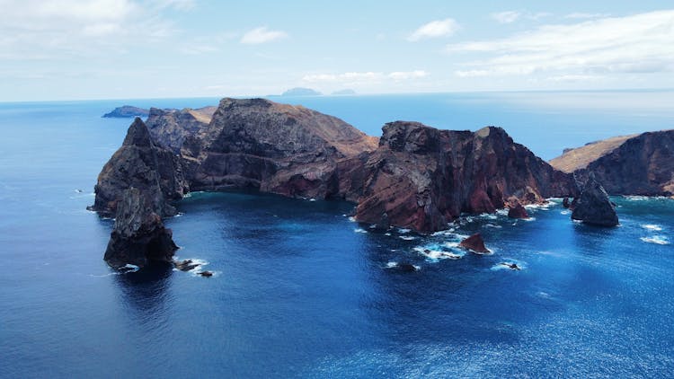 A Deserted Island On The Middle Of The Sea