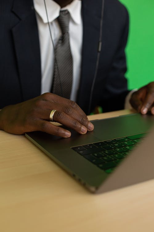 Close-up Photo of Person using Laptop 