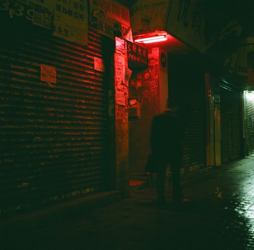 Free Mysterious night street view with red neon light in Kowloon, Hong Kong. Stock Photo