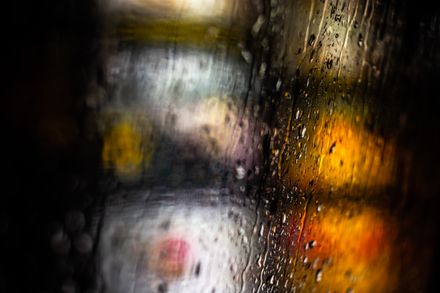 City lights through a rain-covered window — Nothing Ahead on Pexels