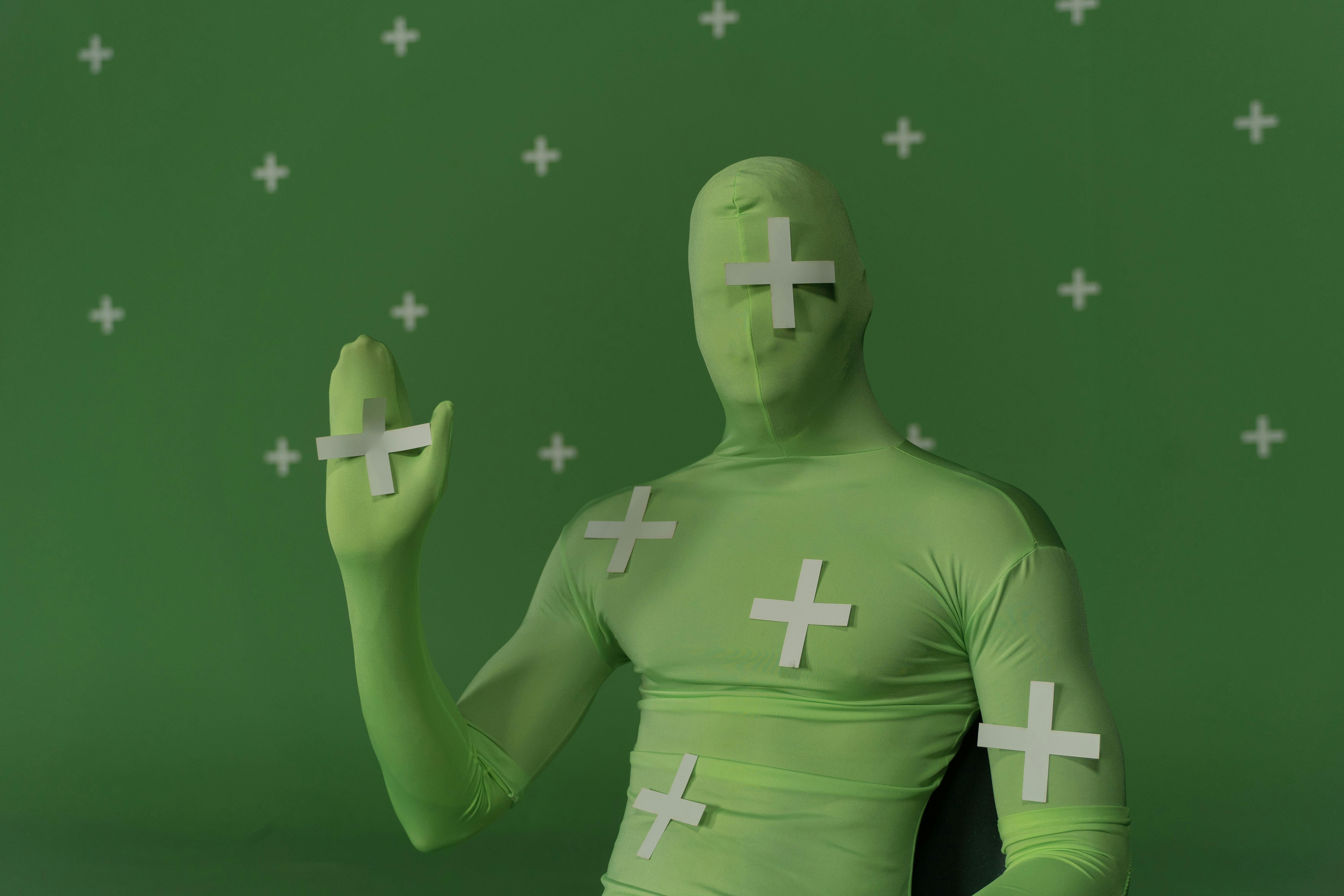 a person wearing a green costume