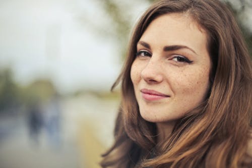 Selective Photography of Smiling Woman