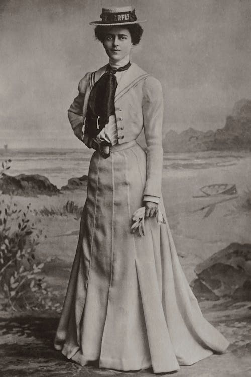 A Grayscale of a Woman in Vintage Clothing