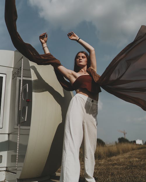 Woman in Brown Top and White Pants 