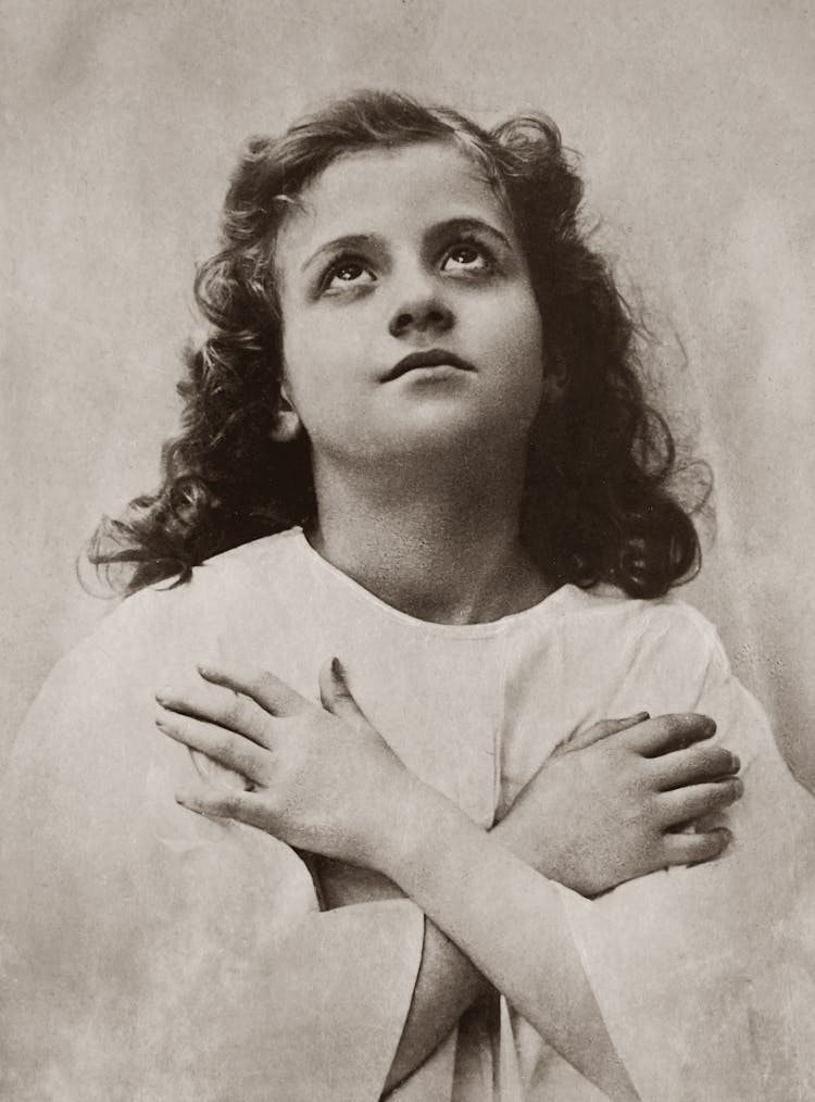 Old Photo Of Girl With Arms Crossed And Looking Up