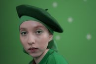 Boy in Green Hat and Green Polo Shirt