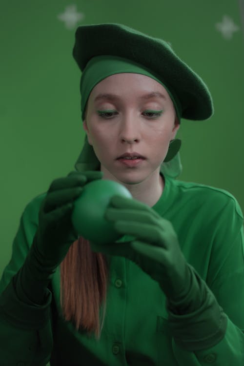 Woman with a Green Beret Holding a Ball