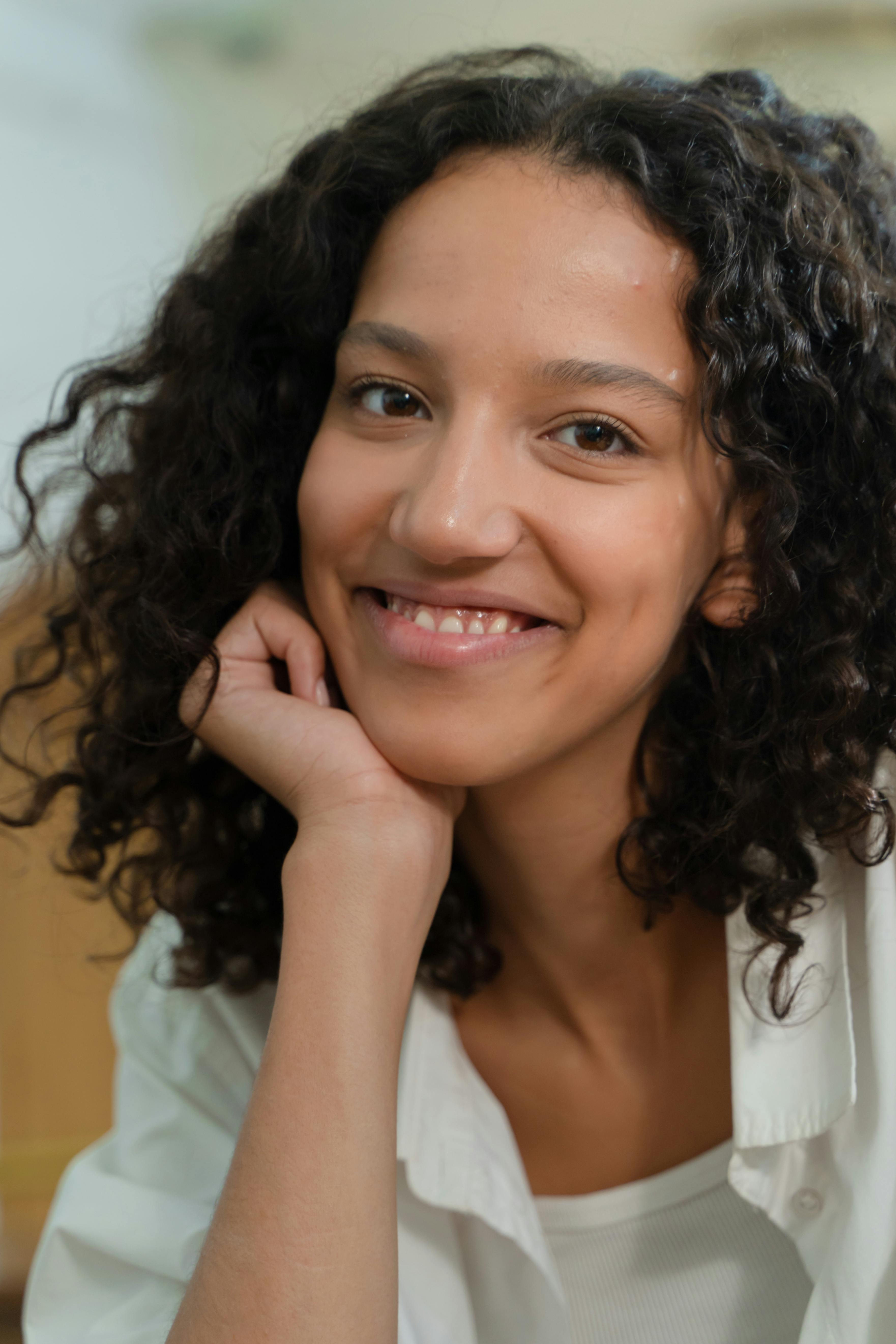 Curly Haired Girl Smiling · Free Stock Photo