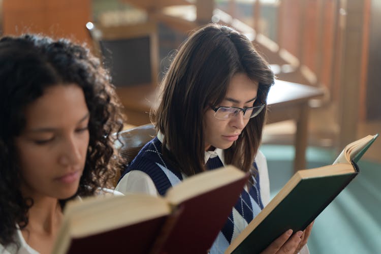 Photo Of Girls Reading Books Together