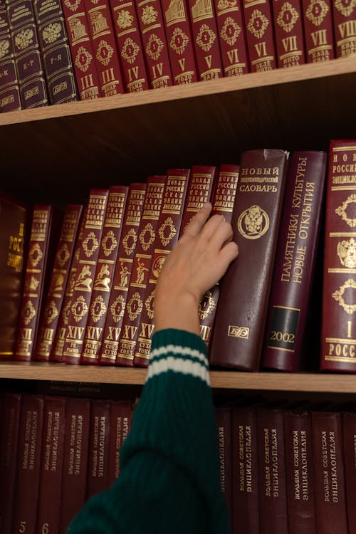 A Person Browsing Books