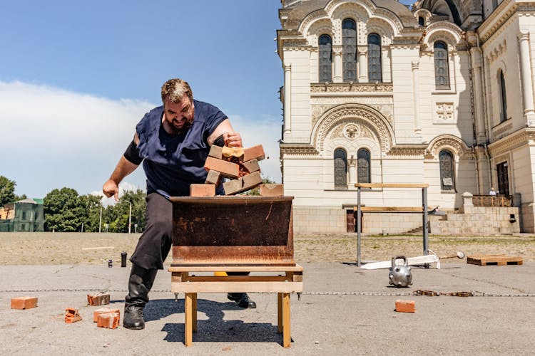 Man Breaking Bricks With Hand