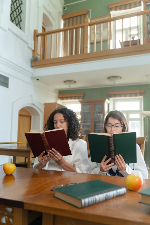 Students in the Library Reading Books 