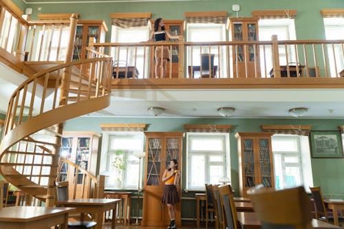 Women Posing while in a Library