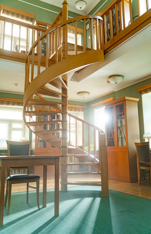 Brown Wooden Spiral Staircase With White Wooden Railings