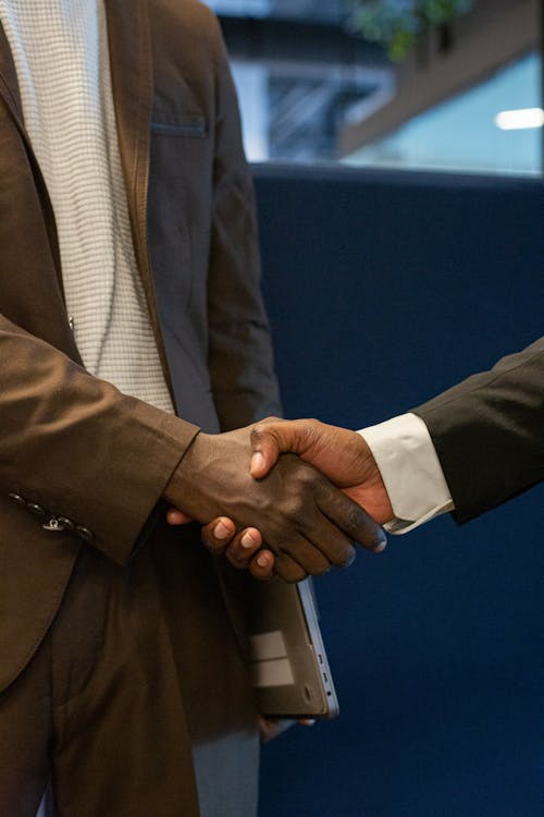Free Close-up Photo of Shaking Hands Stock Photo