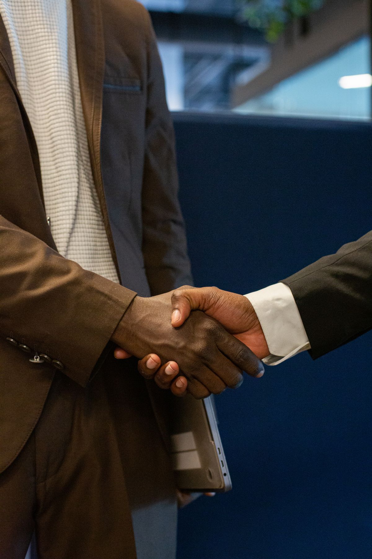 A handshake closing a business meeting