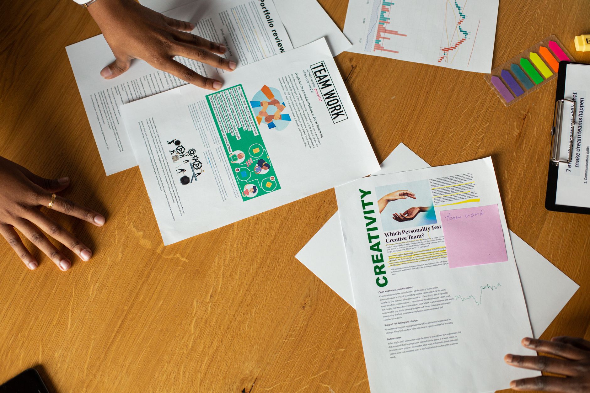 Team members engage in a collaborative document review session, showcasing teamwork and creativity.