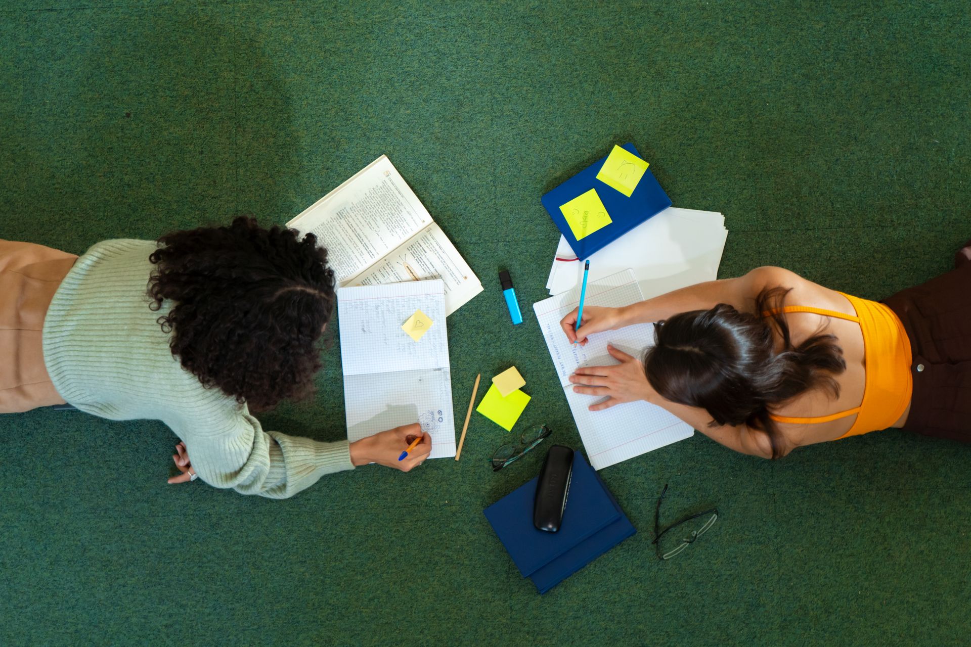 Students Learning Together on Green Carpet