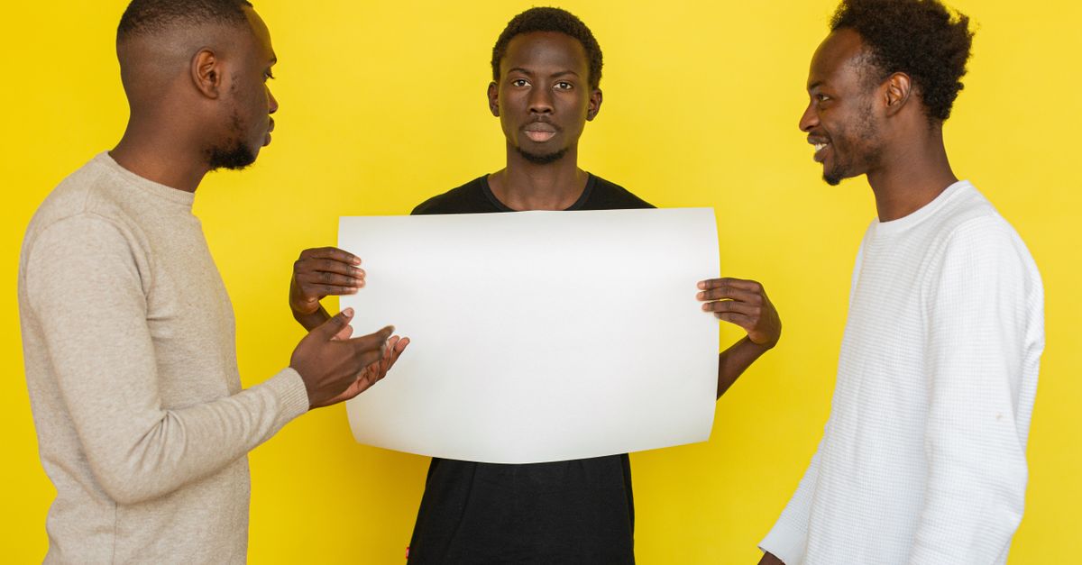 person standing calmly while others around them are arguing or looking skeptical