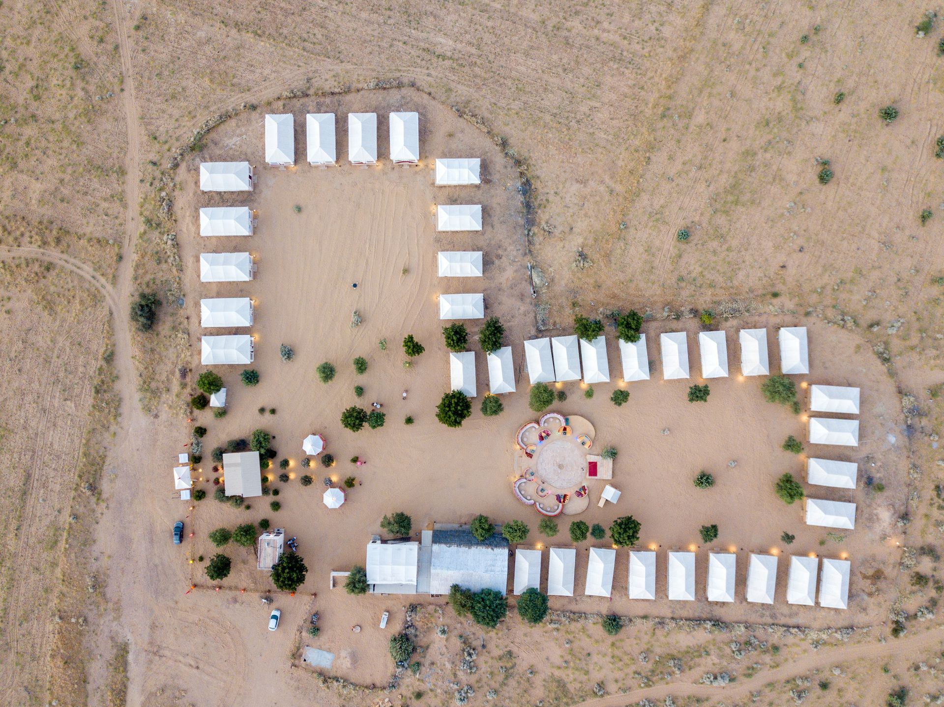Swiss cottage tents lined up at a desert camp in Rajasthan