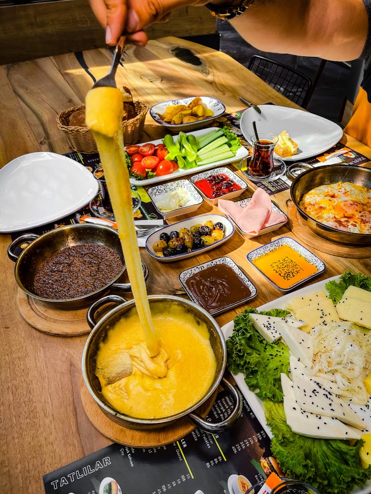 Variety Of Sauces Dips And Snacks Presented On Table