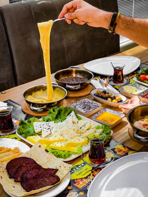 Free A diverse spread of traditional Turkish breakfast foods, featuring cheese, bread, and served with tea. Stock Photo