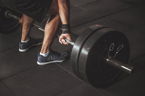 Free Man in Black Reebok Shoes About to Carry Barbell Stock Photo