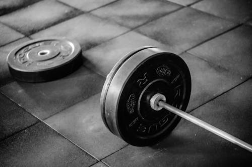 Grayscale Photo of Black Adjustable Dumbbell