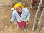 A Happy Woman Holding a Rod