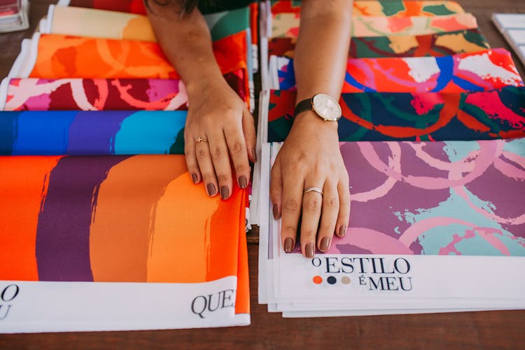 Woman Hands On Colorful Fabrics