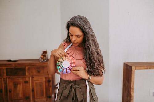 A Fashion Designer Holding a Color Wheel