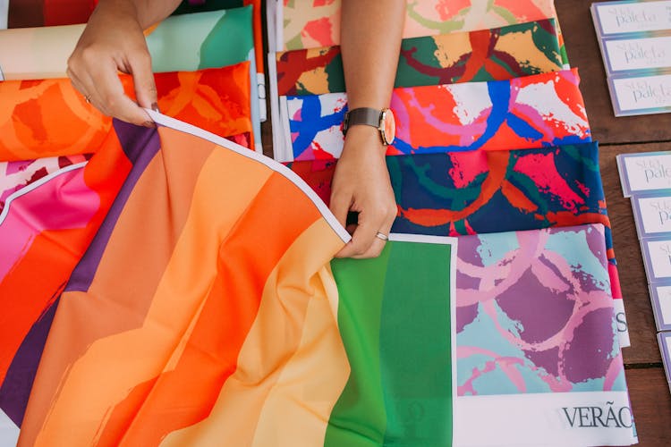 Woman Touching Colorful Fabric 