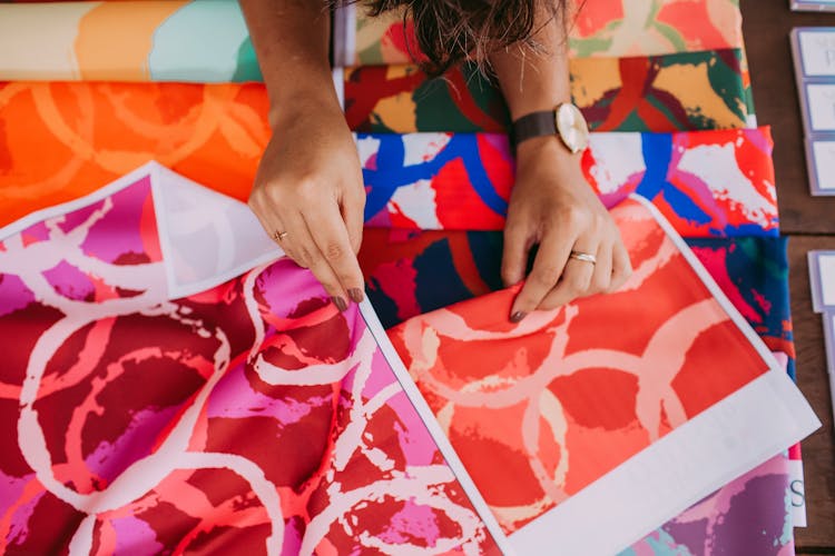 Woman Hands And Colorful Fabric Samples