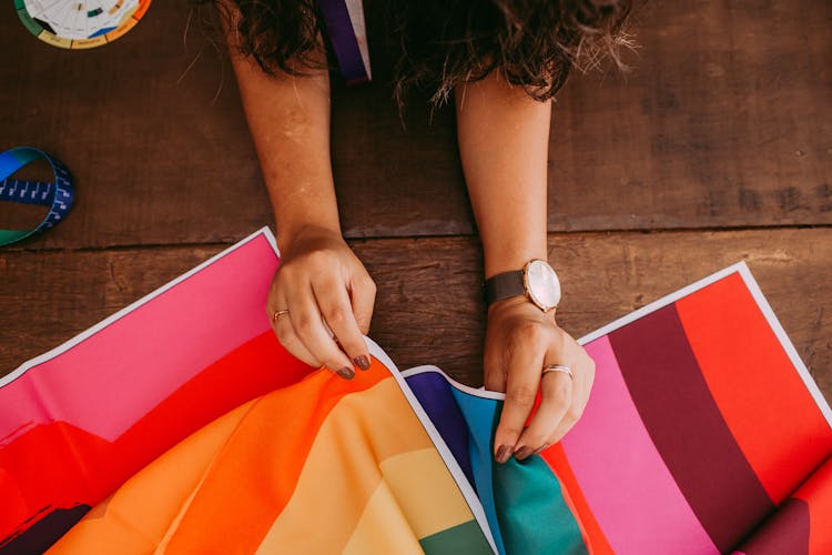 Hands Holding Colorful Fabrics