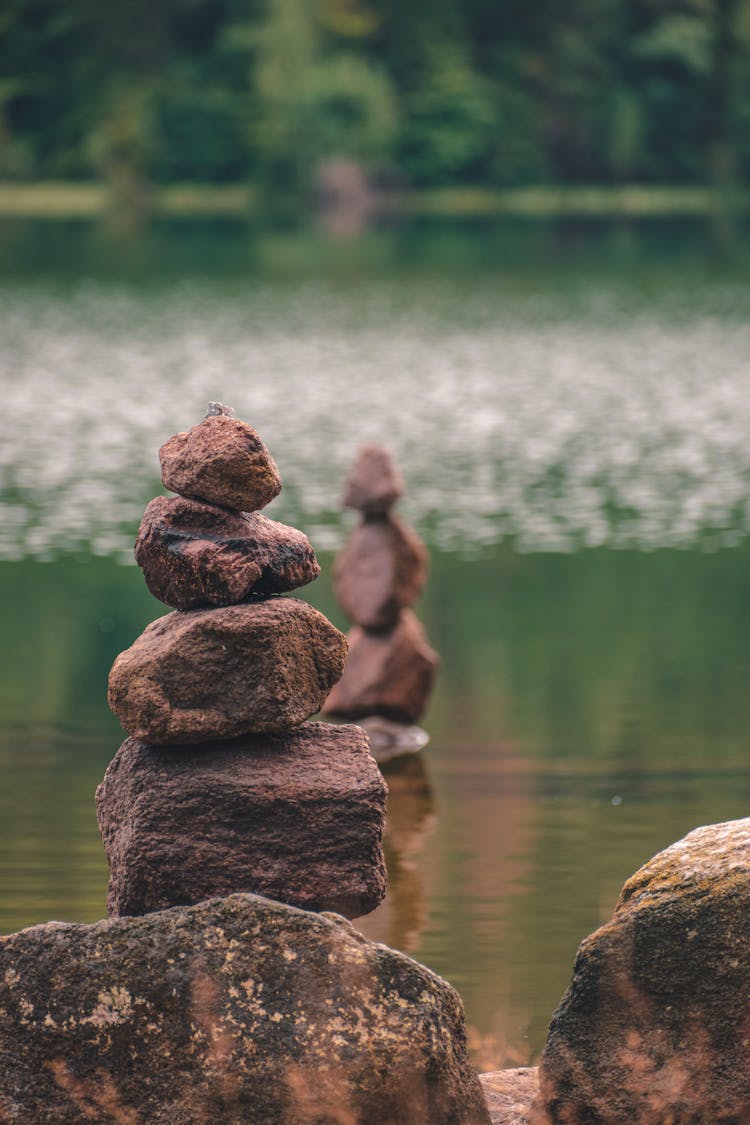 Close-up Of A Stack Of Stones Near Water 