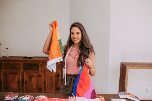 Young Woman Holding Colourful Fabric Samples 