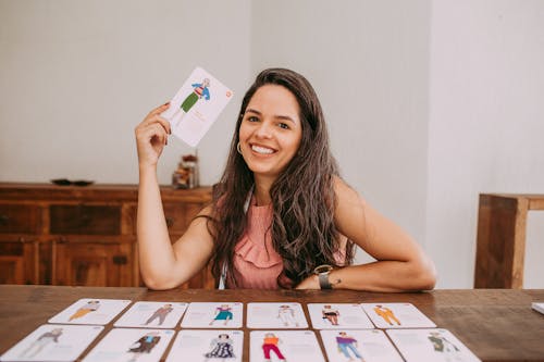 Smiling Woman Holding a Card 