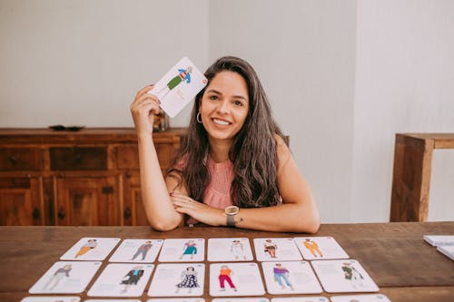 Smiling Woman Holding Education Cards